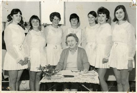 Group of seven dancer students with an examiner