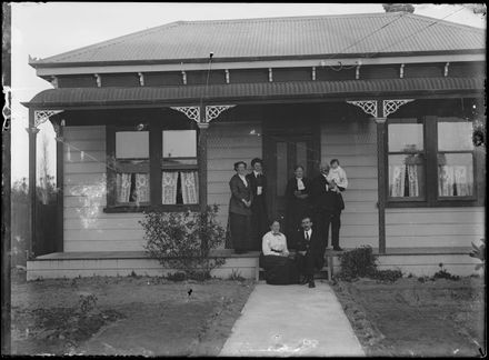 Family Group Outside Cottage