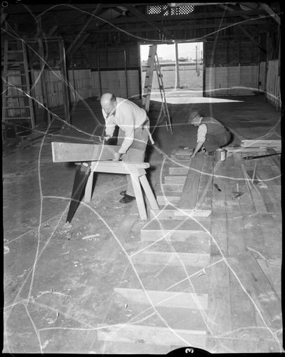 "Preparing For Industries Fair" Workmen Building Stalls