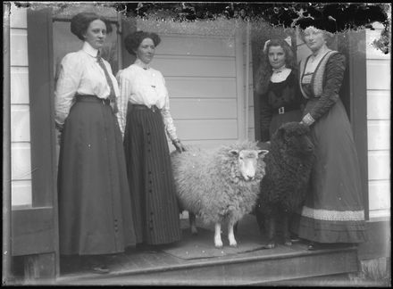 Young Women with Two Pet Sheep