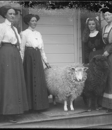 Young Women with Two Pet Sheep