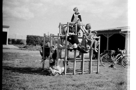 Children on jungle gym at Carnarvon School