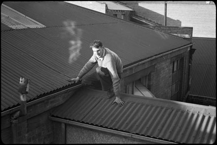 Frank Goldingham scales a roof