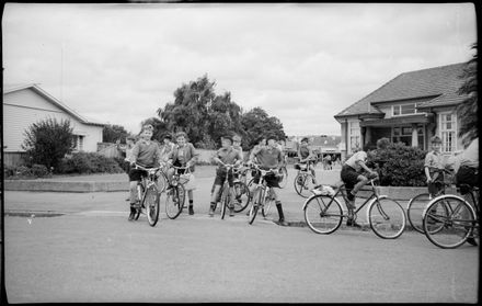 "Hurray! School is Finished" Students Leaving Intermediate Normal School on Their Bikes