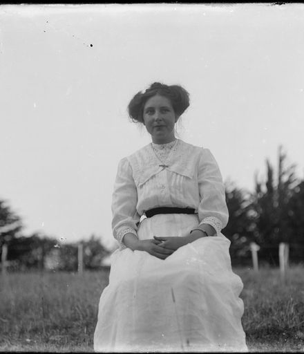 Woman Seated in Field