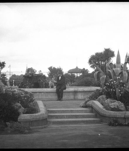 Man and Dog Next to Fountain, The Square