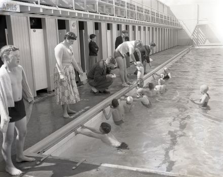 "Young Swimmers Learn Fundamentals"