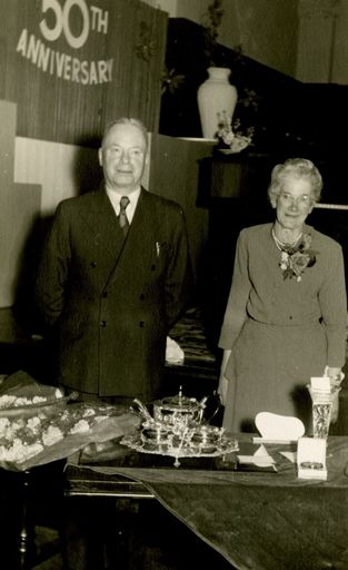 Mr Rodgers, Managing Director, and Sylvia Haycock at celebration to mark Miss Haycock’s 50 years of service for C M Ross Co. Ltd