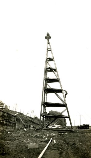 Charlie Rope climbing up the tower to join Ron Grammer - Resource cover image