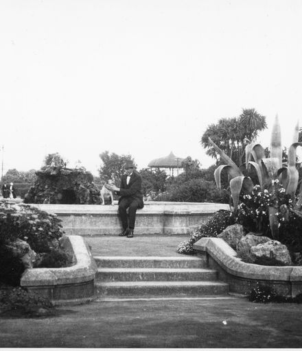 Man and Dog Next to Fountain, The Square
