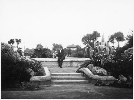 Man and Dog Next to Fountain, The Square