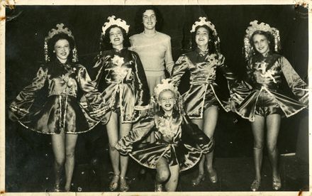 Zona Broughton standing with five dancers
