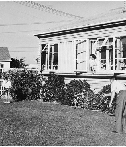 Evans Family Collection: Evans family playing cricket, 5 Mansford Street