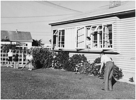 Evans Family Collection: Evans family playing cricket, 5 Mansford Street