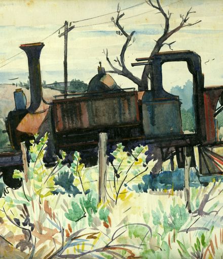 Discarded locomotive in disrepair, in long grass
