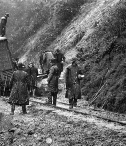 Men working on a derailment in the Manawatu Gorge