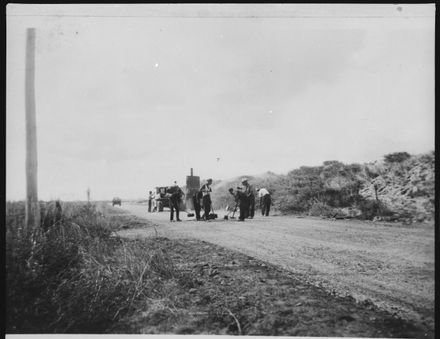 Sweeping the surface of the road to Foxton Beach