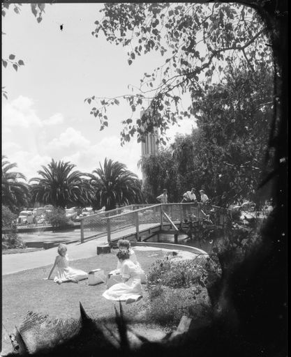 "Relaxing in the Noonday Sun" Visitors in the Square