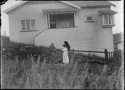 Unknown pair outside hilltop house - Resource cover image