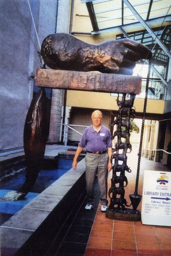 John Collins with Paul Dibble's sculpture 'All Creatures Great,' Palmerston North City Library