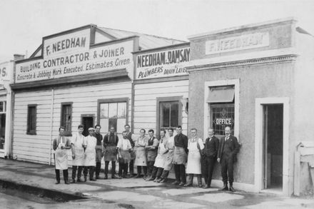 Staff outside F Needham, Building Contractor and Joiner and Needham & Ramsay, Plumber