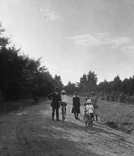 Family walking and biking on Victoria Drive, Victoria Esplanade
