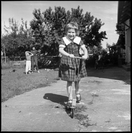 "City Child's Recovery : Playing on her Scooter"