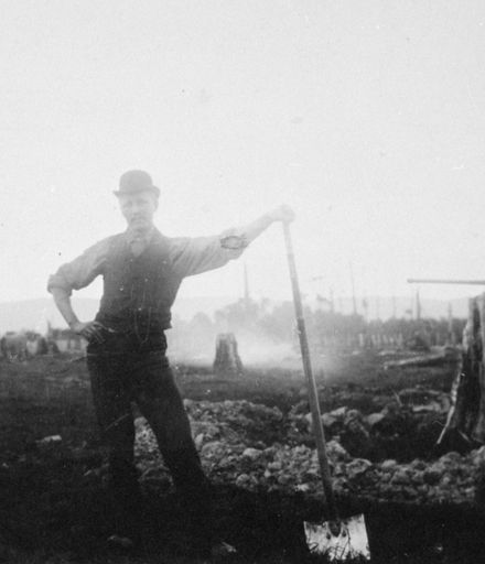 Frederick Johansen removing stumps from property by hand