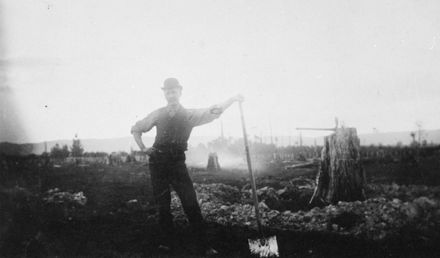 Frederick Johansen removing stumps from property by hand
