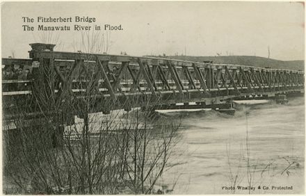 The first Fitzherbert Bridge, with the Manawatū River in Flood