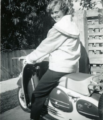 Pamela Burman on her motor scooter, Pahiatua Street