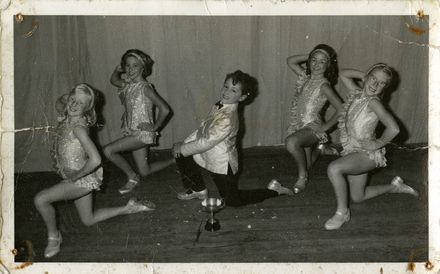 Five dancers with a trophy