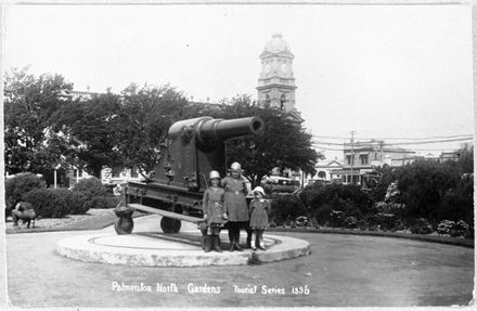 Girls Pose near Cannon