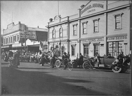 Father Christmases preparing to distribute presents to children on Christmas Day, Rangitikei Street