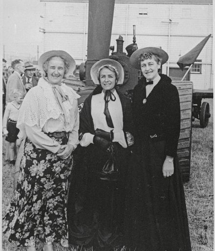 Three women in period costume, clebrating the 75th jubilee