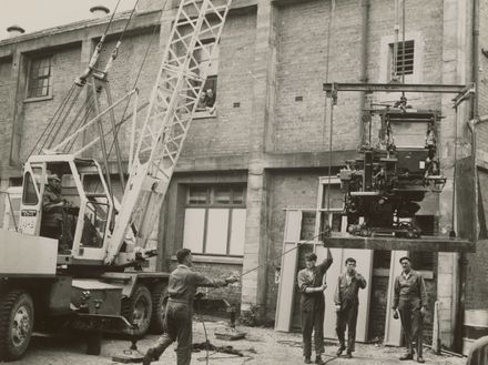 Installing machinery into the Manawatu Evening Standard building, The Square