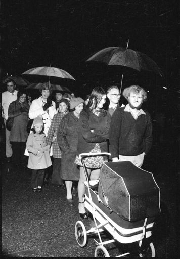 Mourners Wait in the Rain