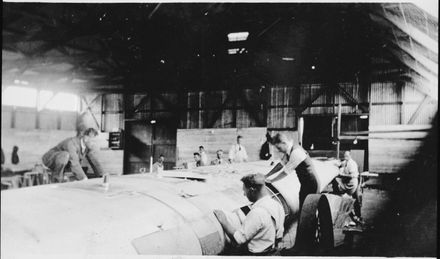 Repairing Sir Charles Kingsford Smith's aeroplane, the "Southern Cross"