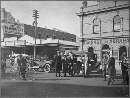 Father Christmases preparing to distribute presents to children on Christmas Day, Rangitikei Street