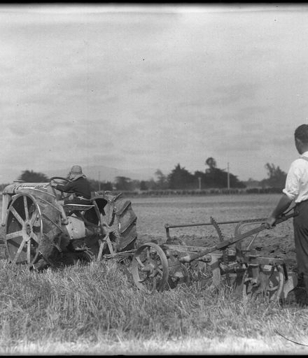 Fordson tractor pulling a plough