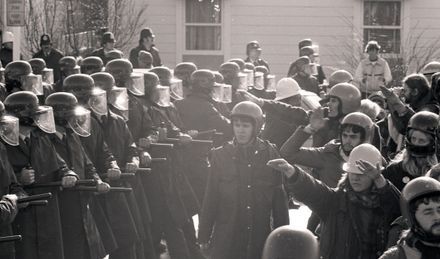Protesters challenge police lines