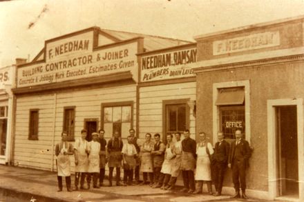 Workmen outside F Needham