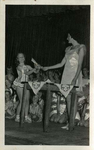 Zona Broughton presenting a certificate