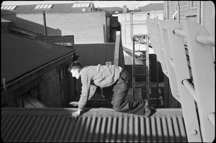 Frank Goldingham scales a roof