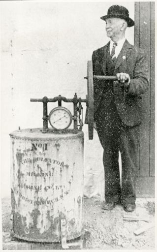 Mr Holben with the First Milking Machine in New Zealand