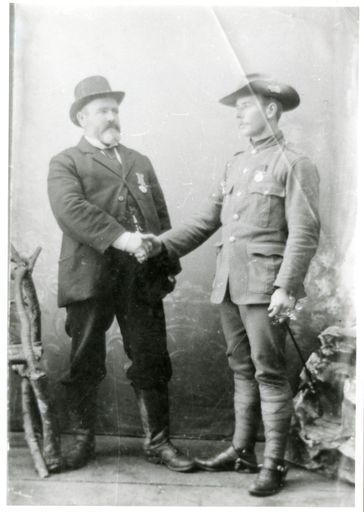 Soldier and Man Shaking Hands