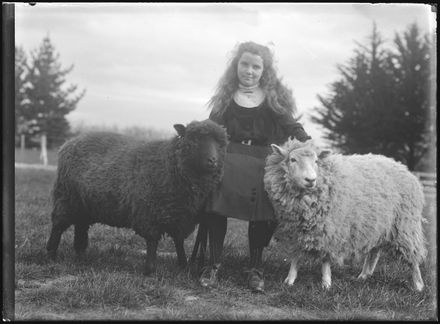 Young Woman with Pet Sheep