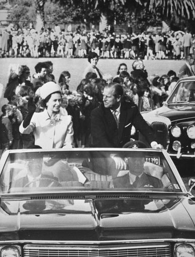 Queen Elizabeth II and the Duke of Edinburgh in open topped car