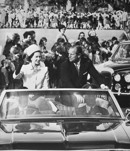 Queen Elizabeth II and the Duke of Edinburgh in open topped car
