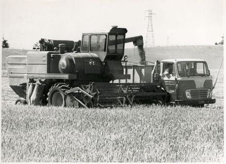 A Massey Fergusson 510 combine harvester and transport truck working in the Colyton area